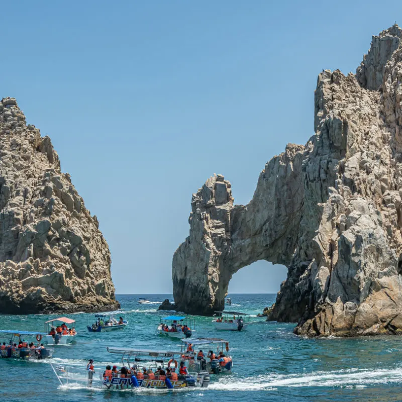 Tourists visiting the famous Arch in Los Cabos