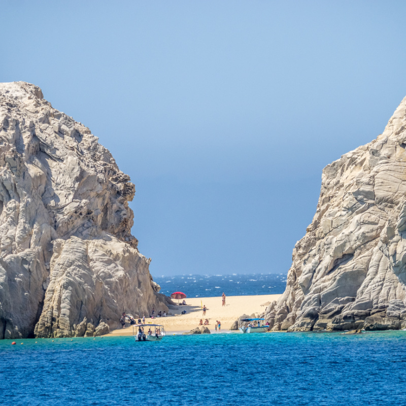 Two-sided lovers' beach between dramatic rock formation in Cabo San Lucas at he extreme southern end of Mexico's Baja California Peninsula, linking the Pacific Ocean and the Sea of Cortez