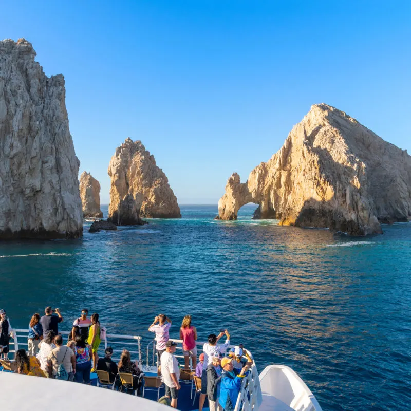tourists on boat in los cabos