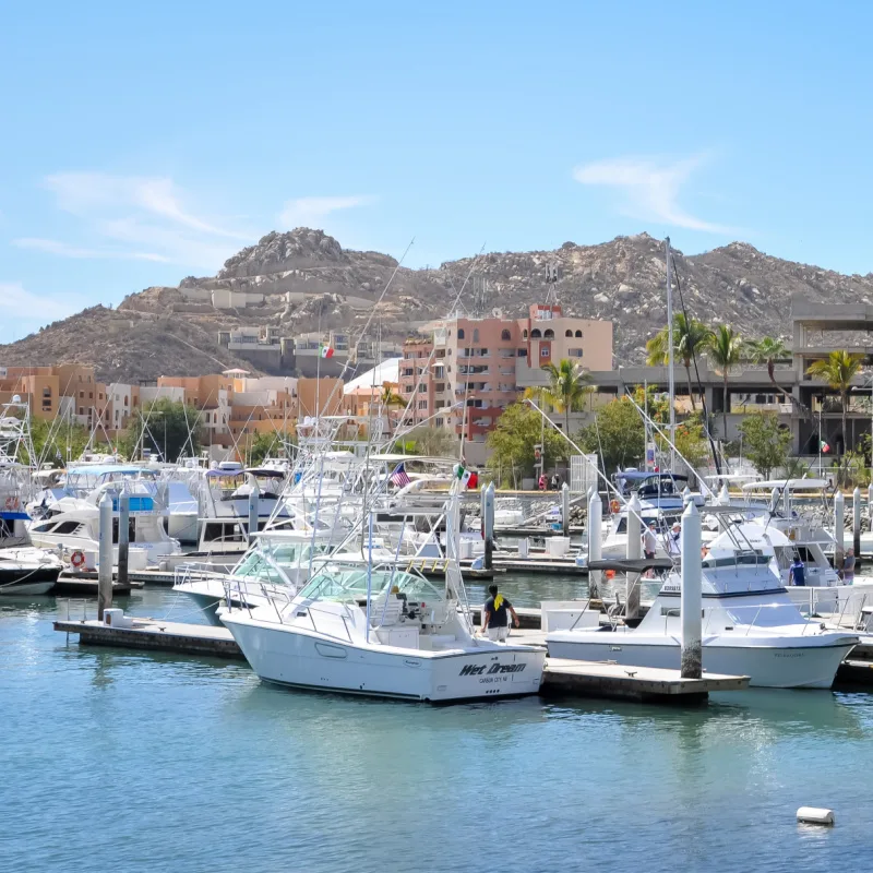 w of boats, buildings and mountains at Igy Marinas in Los Cabos in beautiful day.