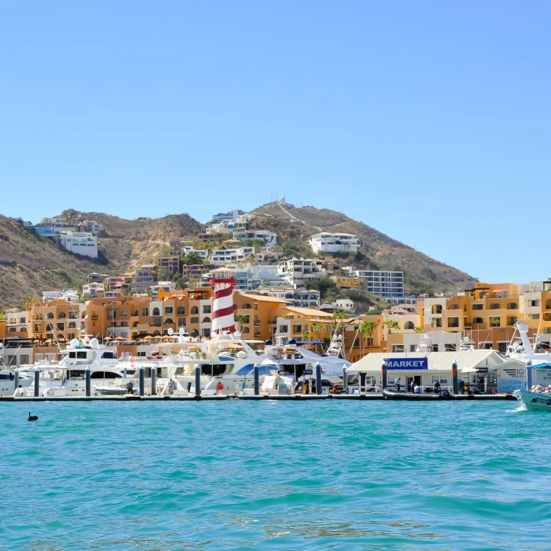 Buildings overlooking the Los Cabos marina in a beautiful day.
