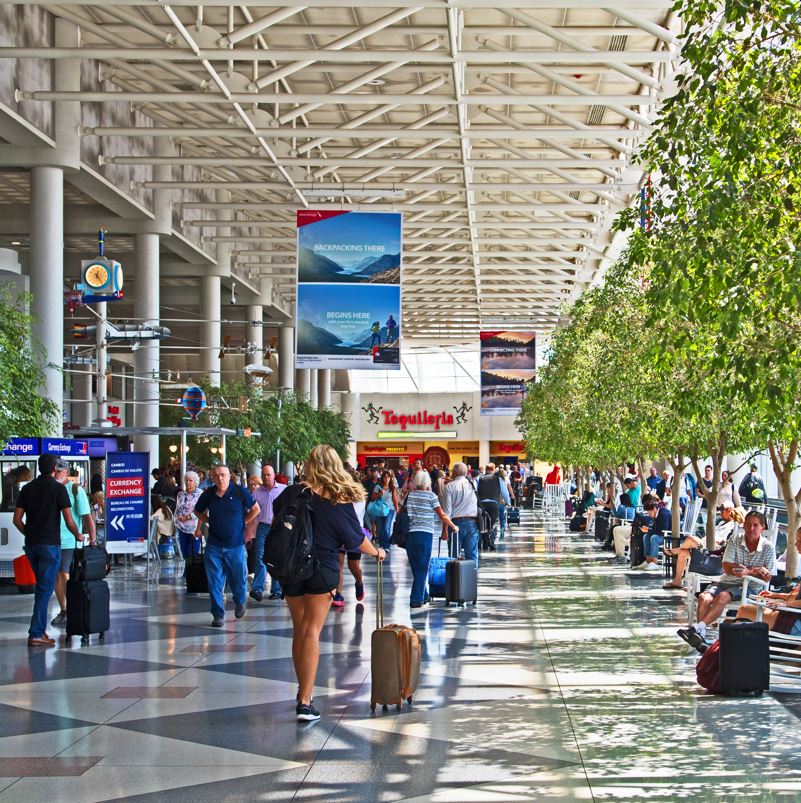 Travelers passing through an area of Charlotte airport