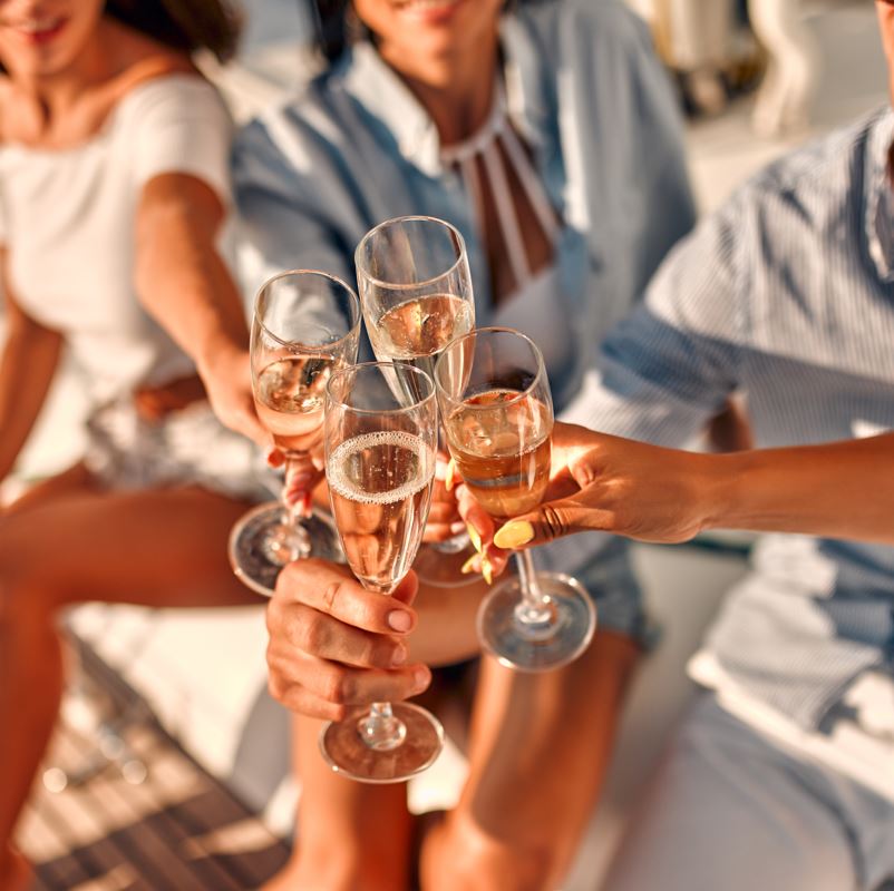 People toasting champagne on a boat cruise