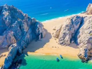 A view of the beach at lovers arch in los cabos from the air