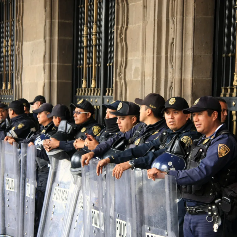Mexican Police Officers in Riot Gear outside building in Zocalo Square, Mexico City