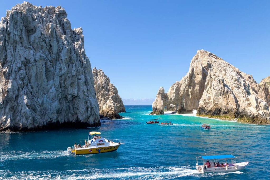 Tour boats sailing near the Los Cabos arch