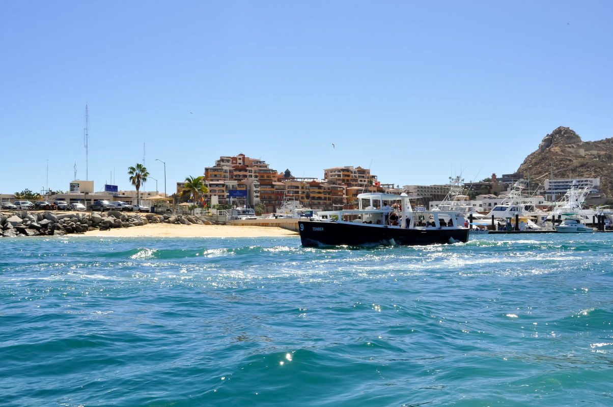 boat and buildings in los cabos