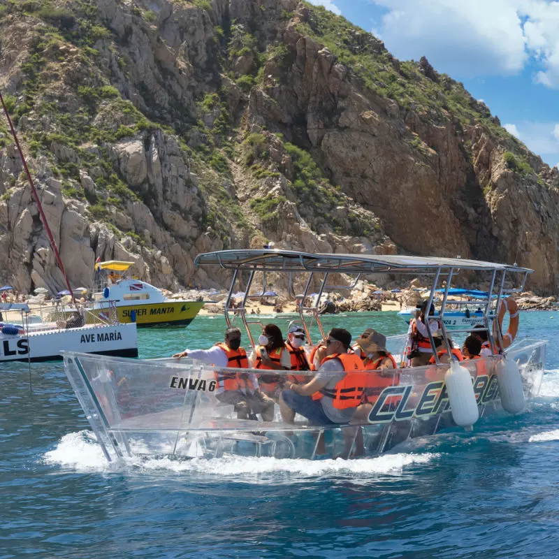 Tourists enjoying a boat tour in Los Cabos.