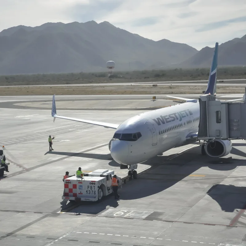 westjet plane parked at los Cabos airport