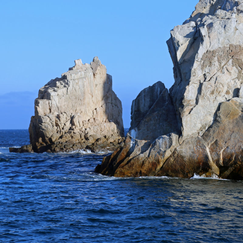Cliffs near Los Cabos arch on a sunny day