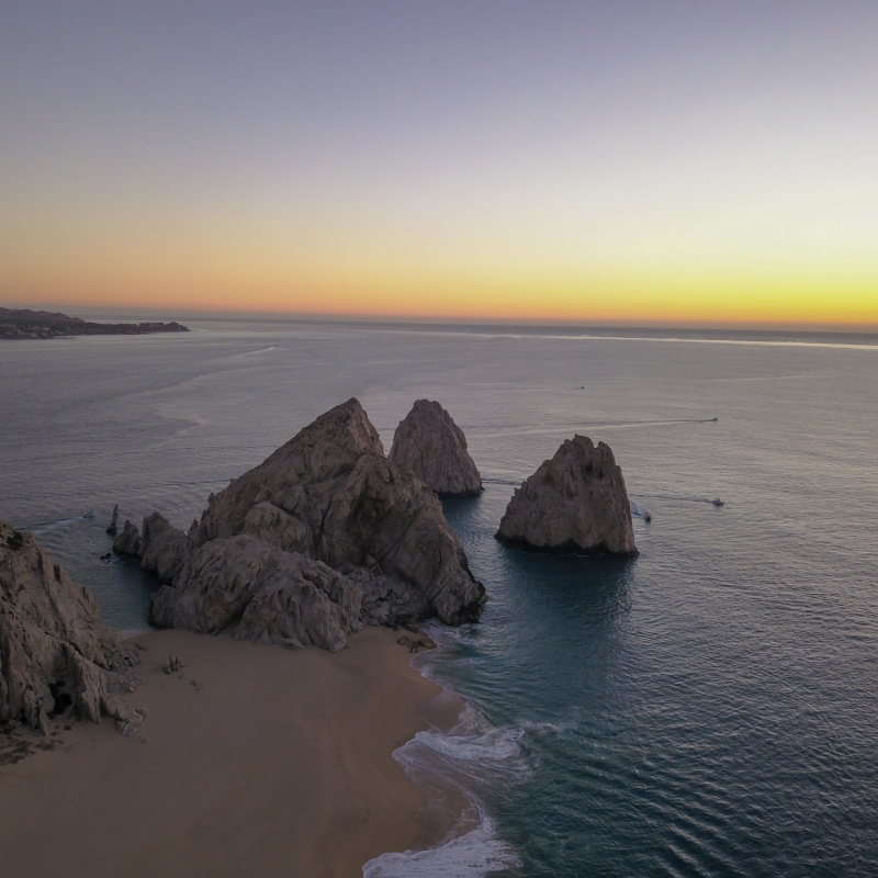 Drone shot Land's end including the arch during sunrise in Cabo San Lucas, Mexico