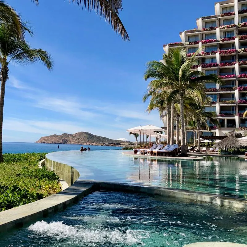 Grand Velas Los Cabos luxury resort pool sunny day