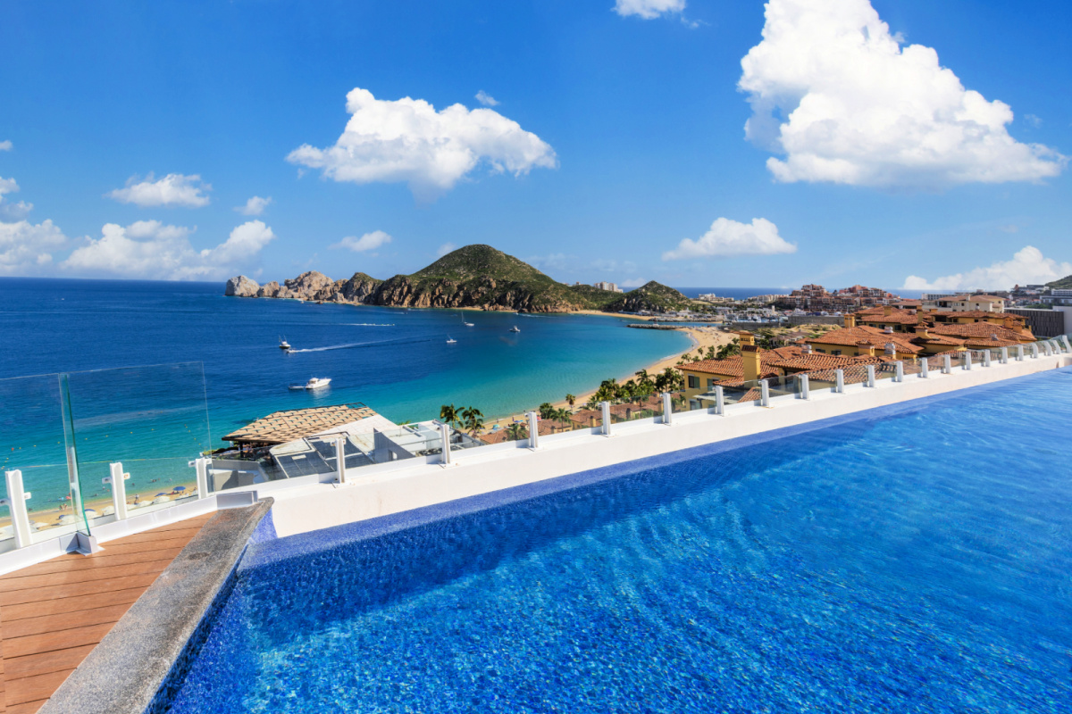 View of a pool in Los Cabos overlooking arch
