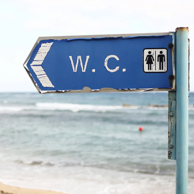 bathroom sign on beach
