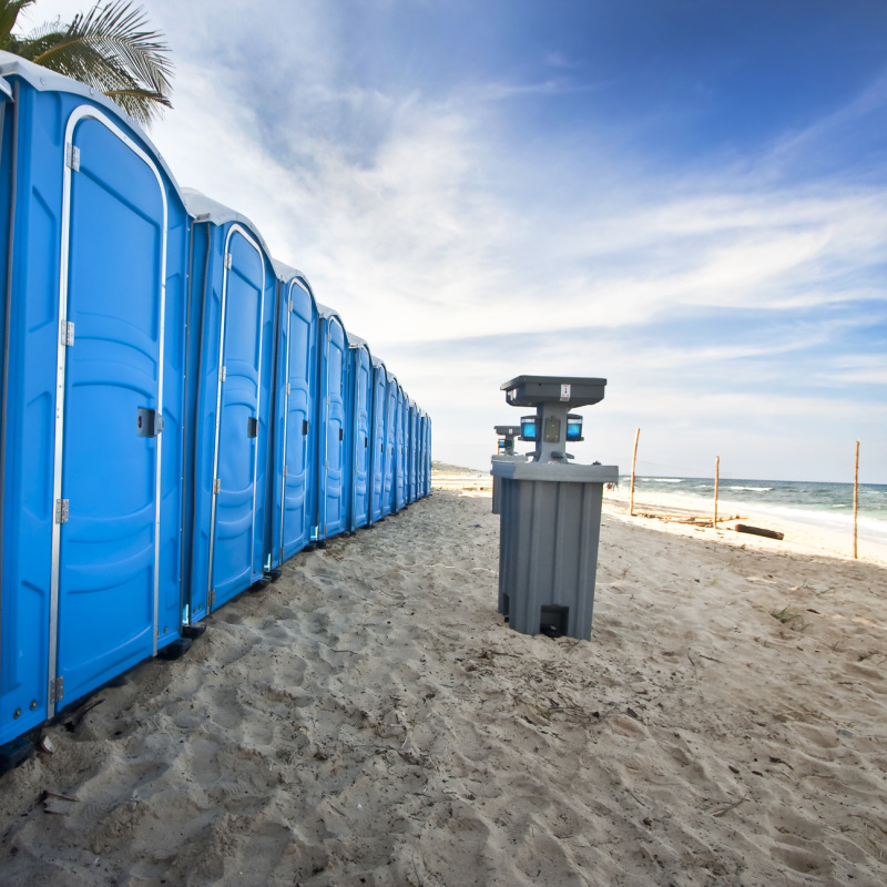 portable bathrooms on a beach