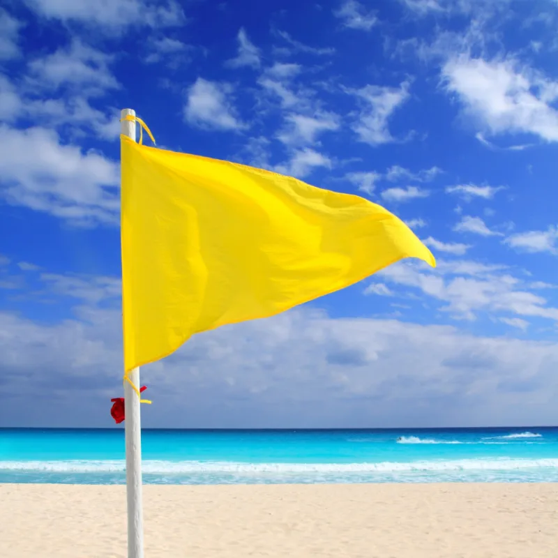 yellow flag on a beach