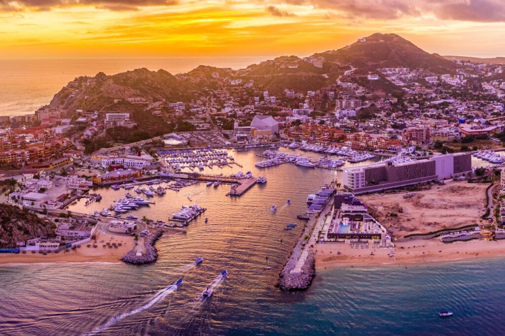 a view of Los Cabos marina during sunset 