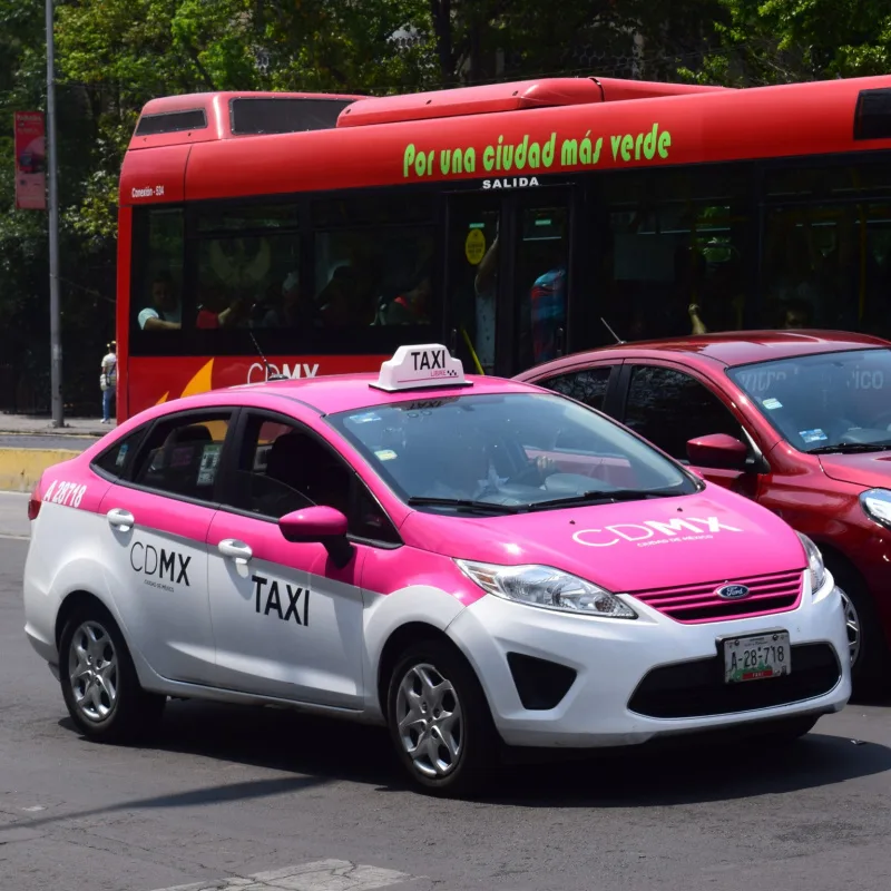 Pink Taxi On a Street in Mexico