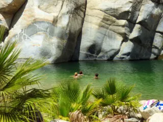 Tourists in the Water in a Hot Spring Near Los Cabos, Mexico