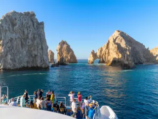 Tourists on a Boat Near the Famous Arch in Cabo San Lucas, Mexico