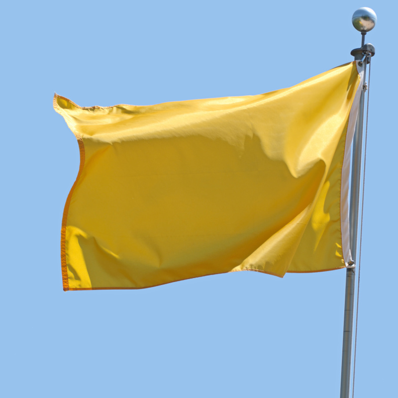 Yellow flag with clear sky