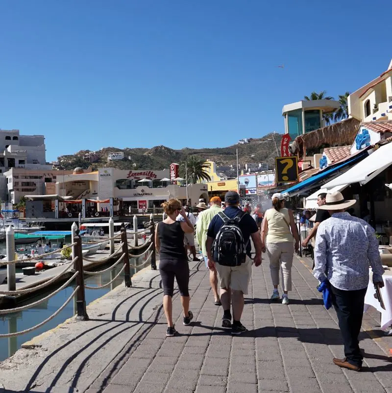 tourists walking along marina