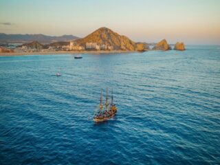 Old wooden ship is sailing in the Pacific Ocean near Baja California