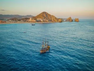 Old wooden ship is sailing in the Pacific Ocean near Baja California