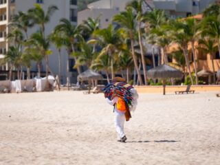Vendor selling items on a Los Cabos beach