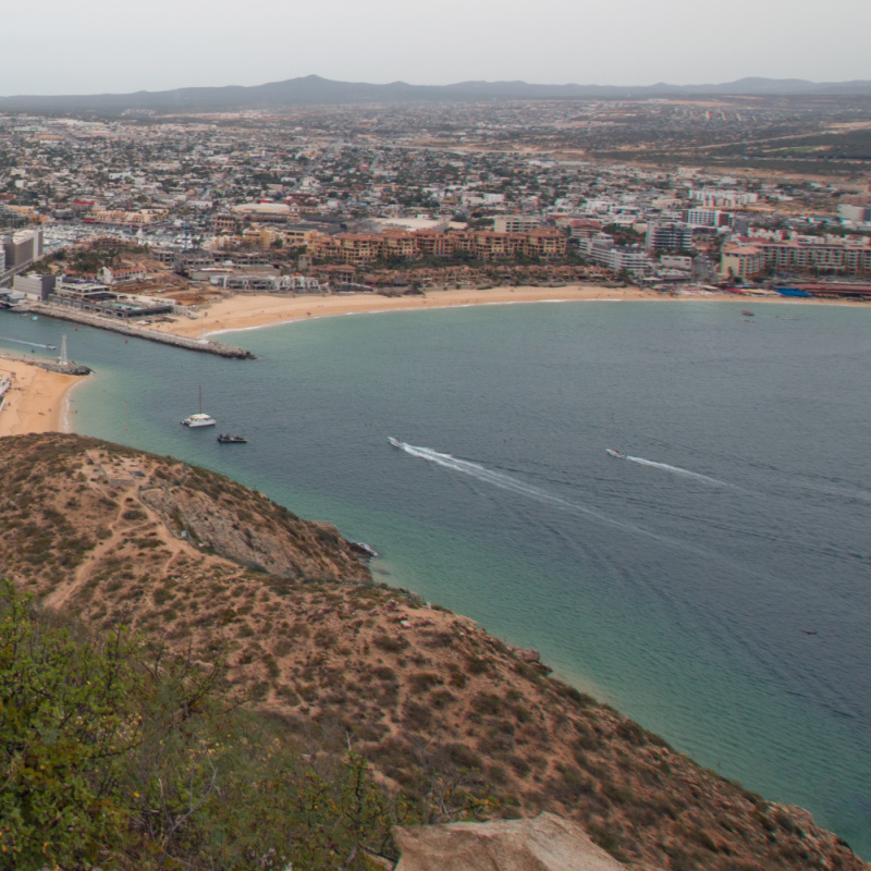 View of Pacific Ocean and Sea of Cortes and Cabo San Lucas marina as seen from the top of the Mount Solmar hiking trail in Baja California Mexico BCS