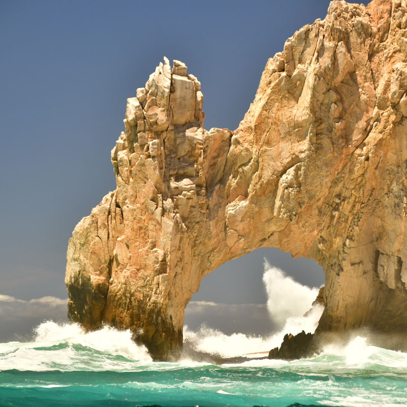 waves crashing on Cabo's arch