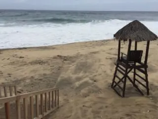 Tropical storm impacting a beach