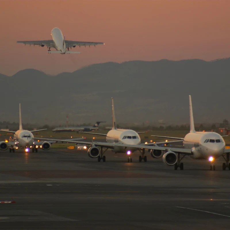 Planes Lined Up at a Busy Airport in Mexico