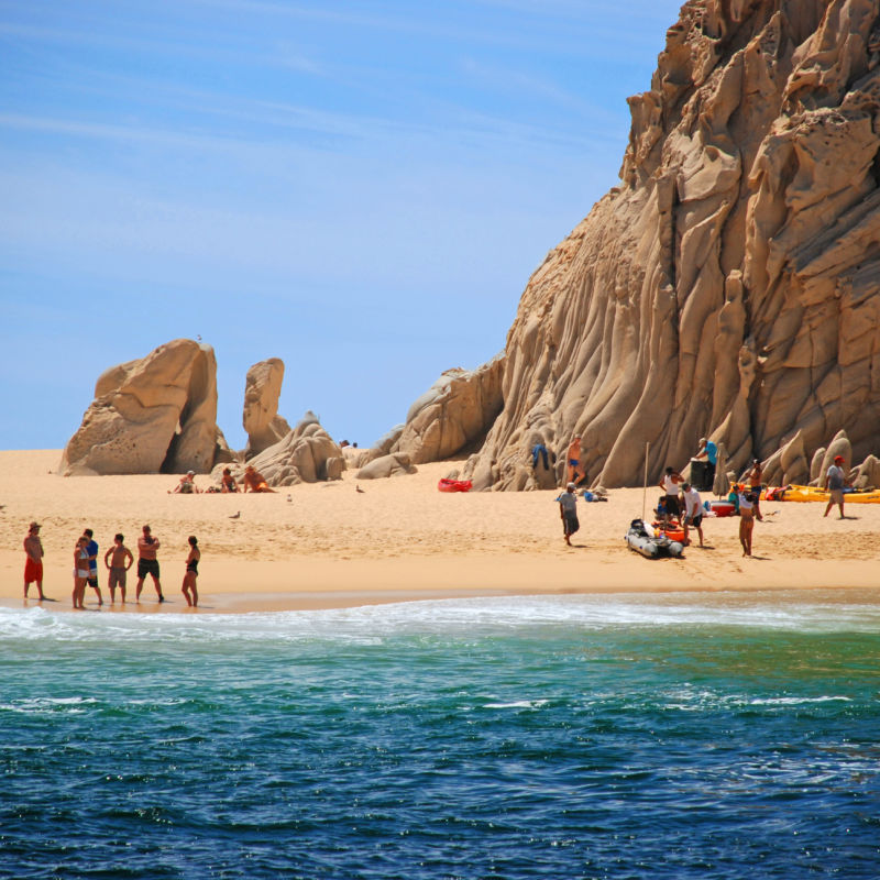 Tourists on Lover's Beach in Cabo San Lucas, Mexico