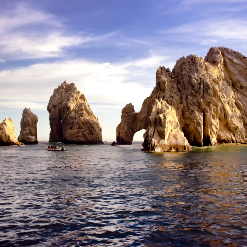 Sun Shining on the Arch and Other Rock Formations in Cabo San Lucas, Mexico