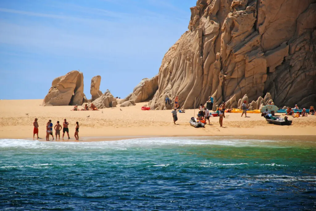 Tourists on Lover's Beach in Cabo San Lucas, Mexico