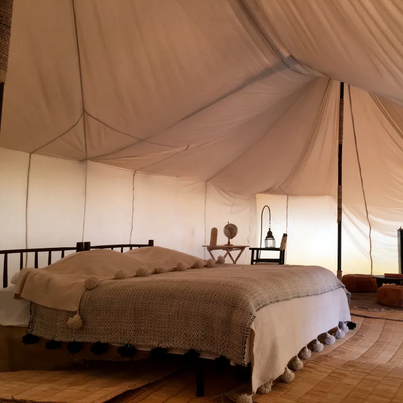 Bed Inside of a Luxury Glamping Tent