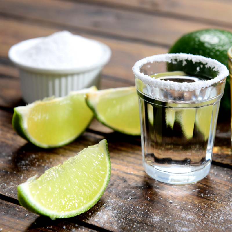 Tequila Shot, Lime, and Salt on a Picnic Table