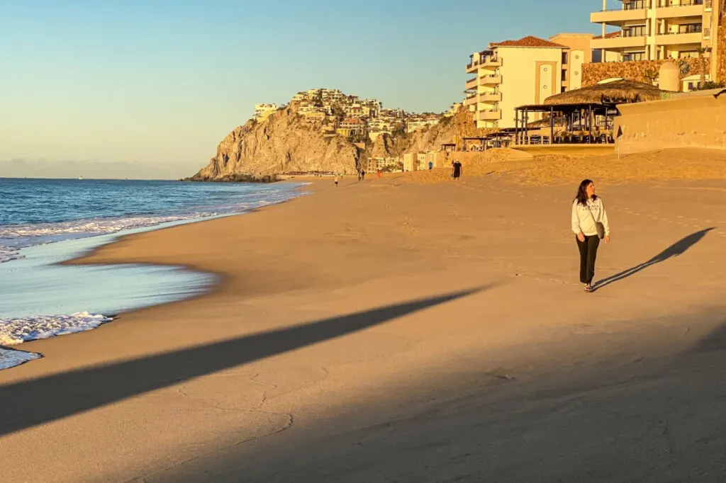 Woman Walking on a Beach in Cabo San Lucas, Mexico