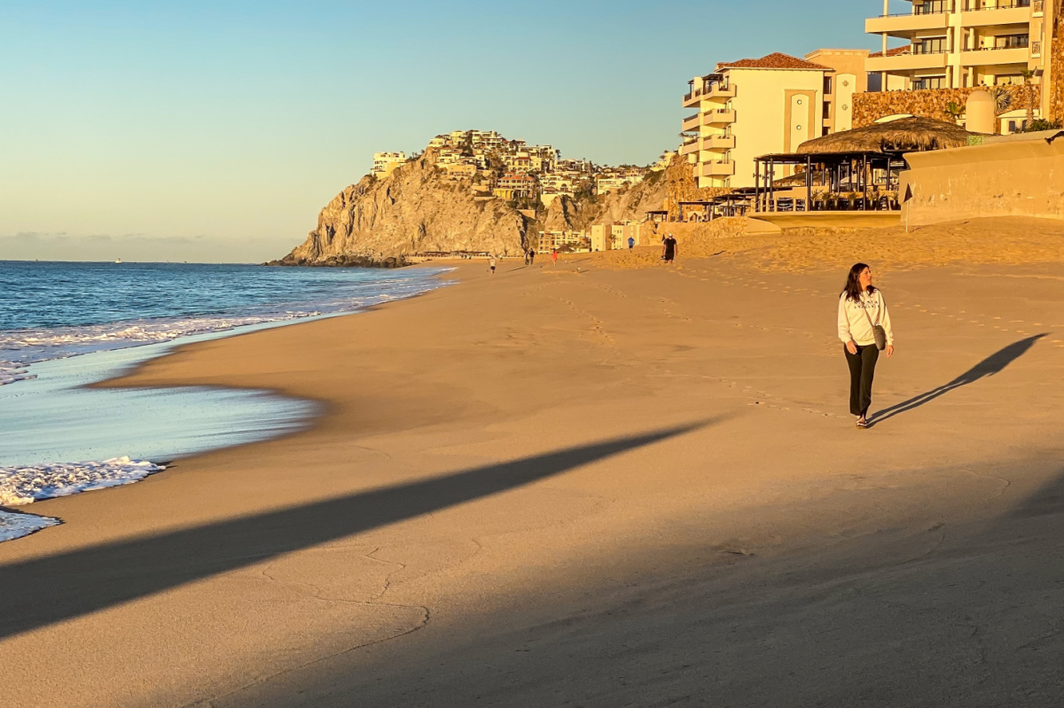 Woman Walking on a Beach in Cabo San Lucas, Mexico