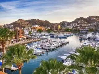 Beautiful wide view on the ocean bay and docks for pleasure boats in golden hour Marina