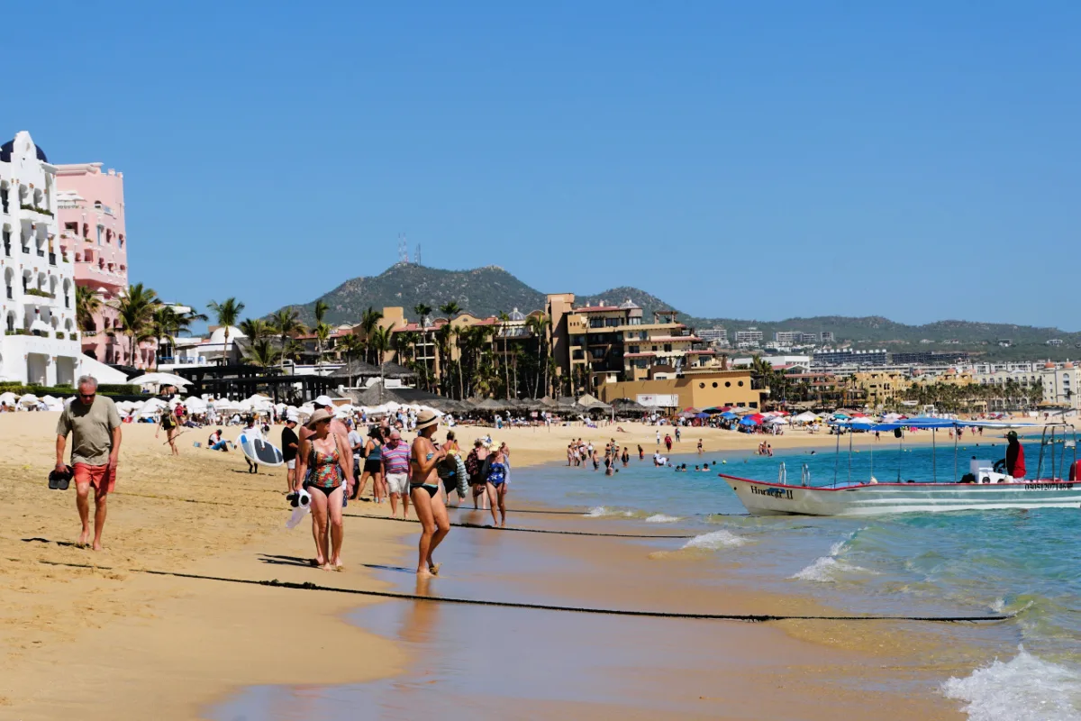 People walking on beach in Los Cabos