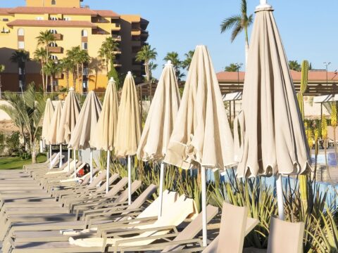 Reserved pool chairs with towels on them