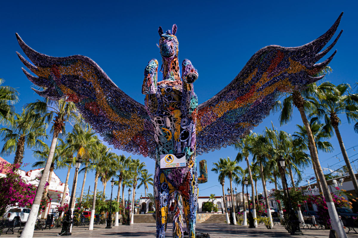 TODOS SANTOS, B.C.S., MEXICO - A fantastic colorful metal winged horse sculpture by Juan Sotomayor in the town's main plaza area. The town is known for its art and galleries.