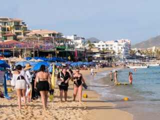 Cabo San Lucas BCS MEXICO. Tourists enjoying the holidays in Los Cabos on EL MEDANO beach, on a sunny and busy afternoon.