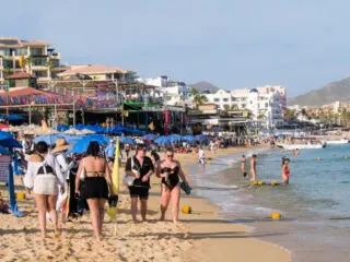 Cabo San Lucas BCS MEXICO. Tourists enjoying the holidays in Los Cabos on EL MEDANO beach, on a sunny and busy afternoon.