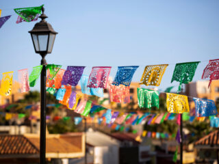 Colorful Papel Picado hangs in a public plaza in downtown Cabo San Lucas,Baja California Sur, Mexico.