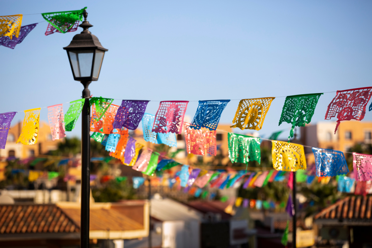 Colorful Papel Picado hangs in a public plaza in downtown Cabo San Lucas,Baja California Sur, Mexico.