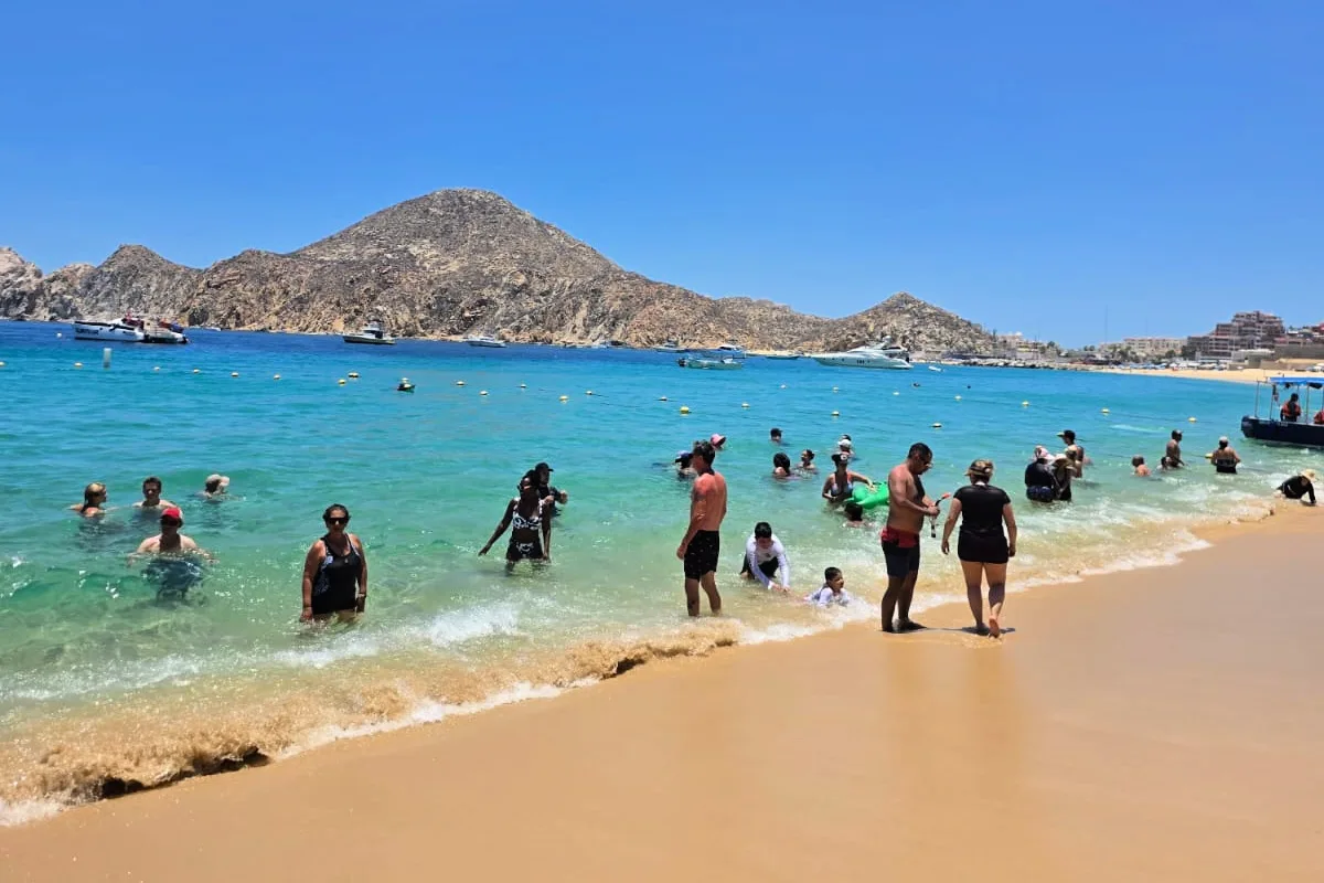 People on Medano Beach enjoying a sunny day in Los Cabos