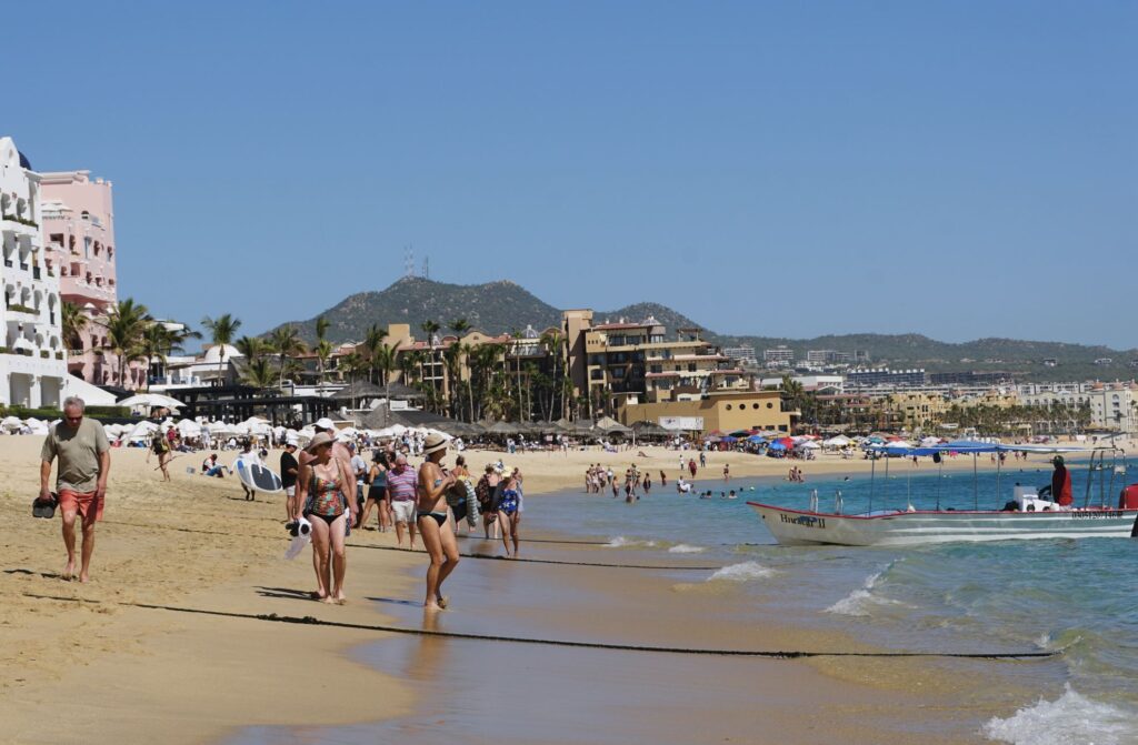 Tourists on beach in Cabo